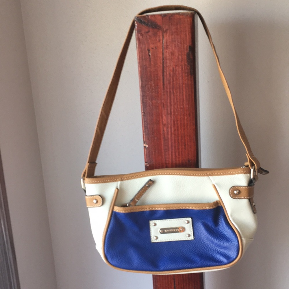 A white faux leather Rosetti purse